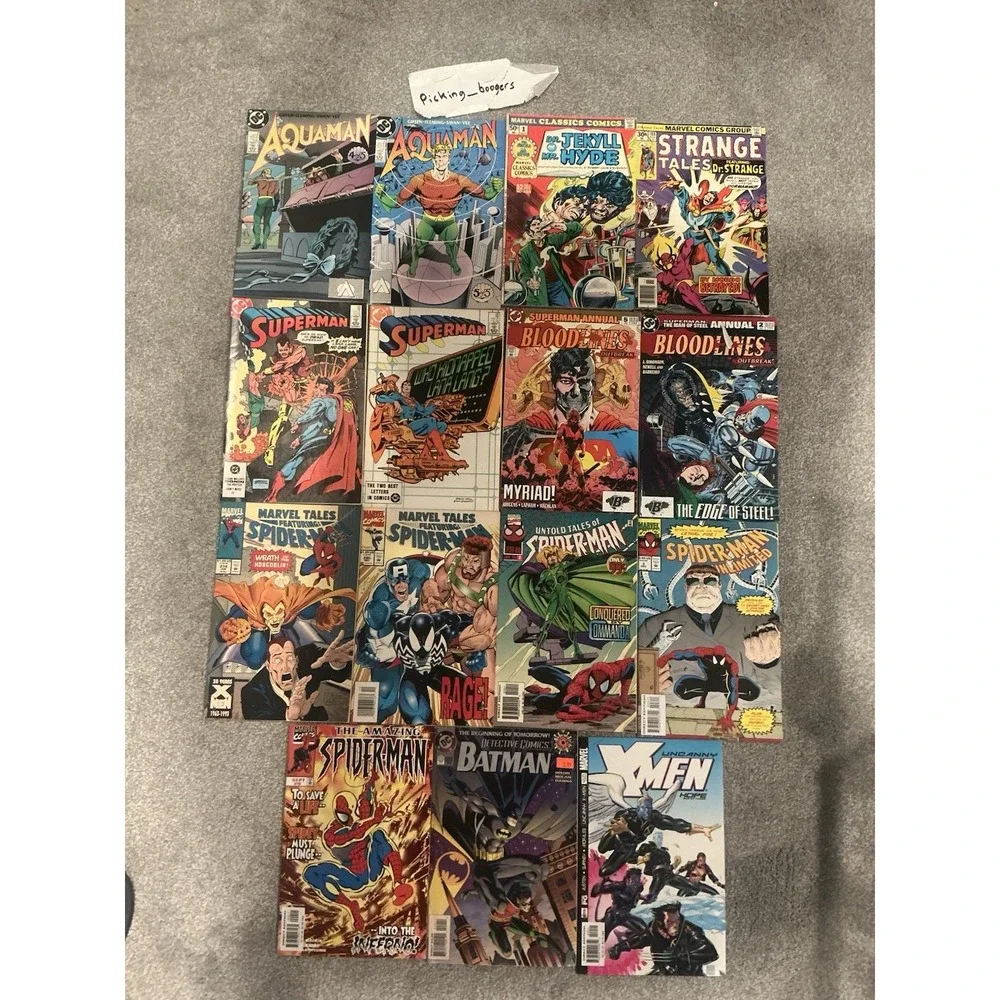 Vintage 15 lot of superhero comic books from both DC and Marvel publishers.